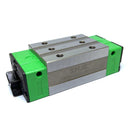 Abdul Traders GRH 25CA SHAC linear guide block with green end caps and silver metal casing.