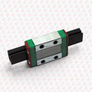 Abdul Traders WERB MGN 9C miniature linear guide block for 9mm rails with green end caps on a patterned background