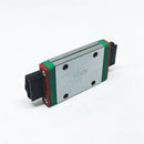 Abdul Traders WERB MGW 7H miniature linear guide block for 7mm wide rails with green end caps on a white background