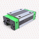 Abdul Traders QHH 20CA SHAC CNC linear guide block with green end caps and metallic rail interface