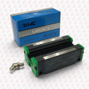 Abdul Traders SHAC GHH 20 CA linear guide block with green end caps and lubrication fitting next to its blue box