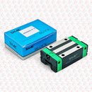 Abdul Traders SHAC QHH 20CA linear guide block with green end caps and blue packaging box for CNC machinery.