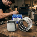 Abdul Traders YFB NA 6907 needle roller bearing with its blue packaging on a workshop workbench with a technician.